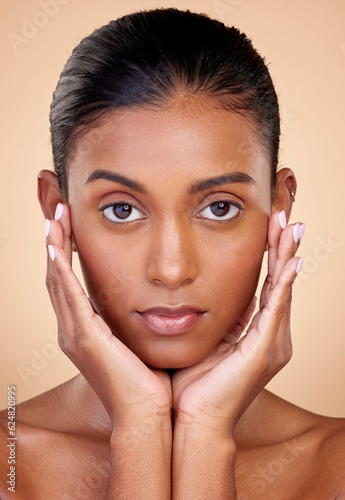 Portrait, skincare and beauty with indian girl for dermatology with glow in brown studio background. Natural, face and healthy skin with cosmetics or spa treatment for self care in mock up for shine.