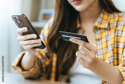 Digital Finance at Fingertips: Close-Up Hands Seamlessly Handling Bills and Smartphone for Efficient Online Payment and Financial Management