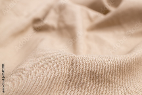 Natural linen fabric texture. Rough crumpled burlap background. Selective focus