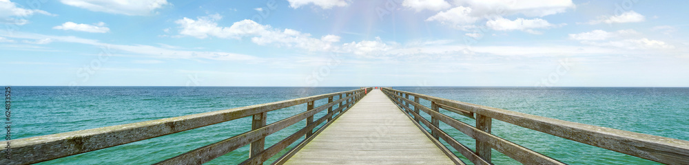 Wooden landing walkway at the sea with view to the water