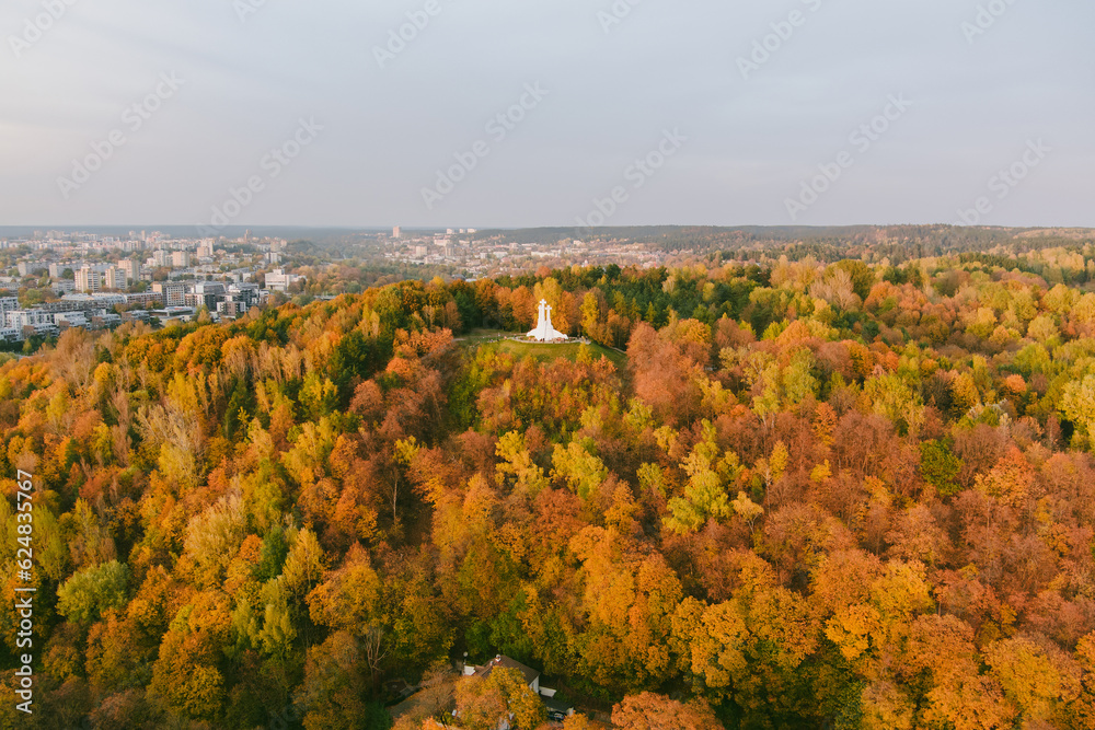 Aerial view of the Three Crosses monument overlooking Vilnius Old Town on sunset. Vilnius landscape from the Hill of Three Crosses, Vilnius, Lithuania