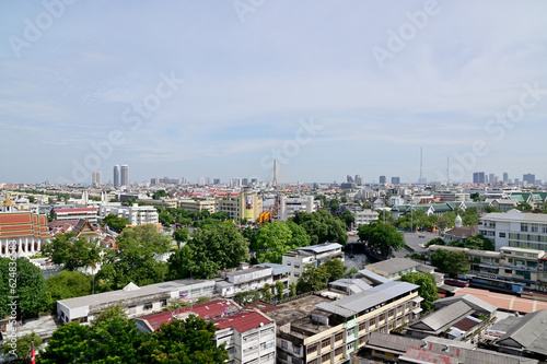 BANGKOK, THAILAND - July 22, 2023 : Landscape View of Bangkok City and Thai Buddhist Temple with Blue sky with white cloud. Clear day and good weather in the morning.