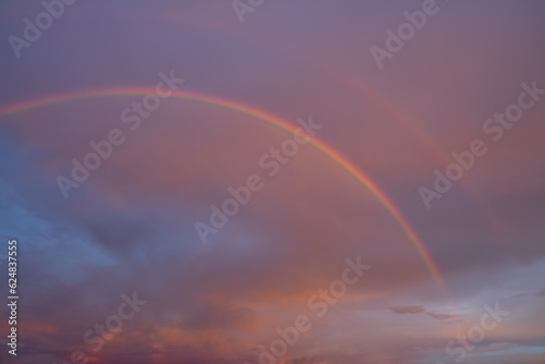 Double rainbow occur on sky in early morning with cloud and multicolor look beautiful and express bright future concept