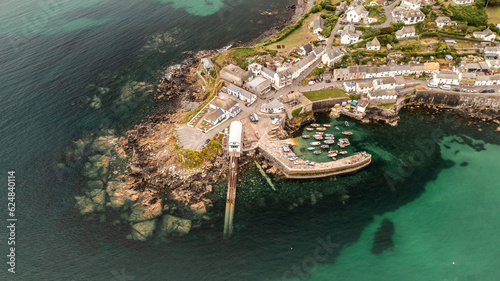 Aerial view of the Cornish fishing village of Coverack and its traditional harbour
