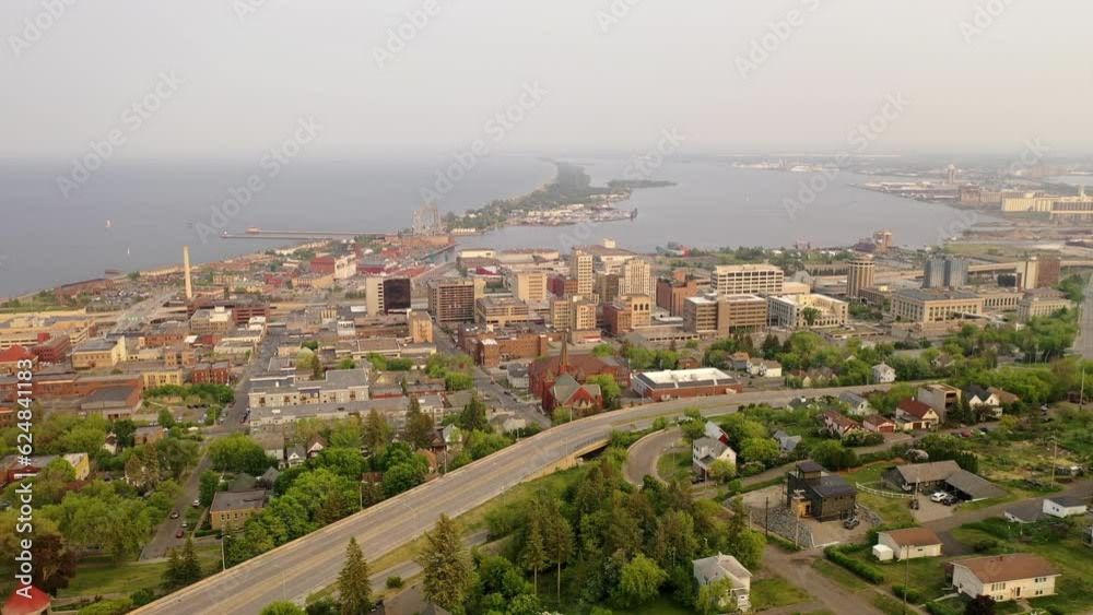 Downtown Duluth, Minnesota, with historic landmarks, modern skyline, lively streets, and scenic waterfront. Aerial view Downtown Duluth, Minnesota, with historic landmarks, modern skyline, lively streets, and scenic waterfront. Aerial view