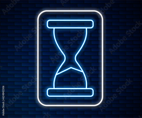 Glowing neon line Old hourglass with flowing sand icon isolated on brick wall background. Sand clock sign. Business and time management concept. Vector