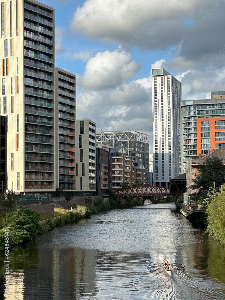Modern buildings next to the river in Manchester city centre. 