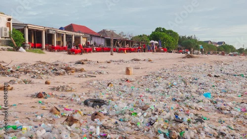 Tropical Bali beach polluted plastic waste. Indonesia is one of the world leaders in plastic waste: annually up to 200 thousand tons of plastic are dumped into rivers and the ocean photo