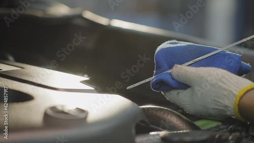 Check engine oil level close up 50fps