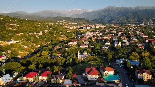 Mosque at sunrise agains the mountains in Almaty photo