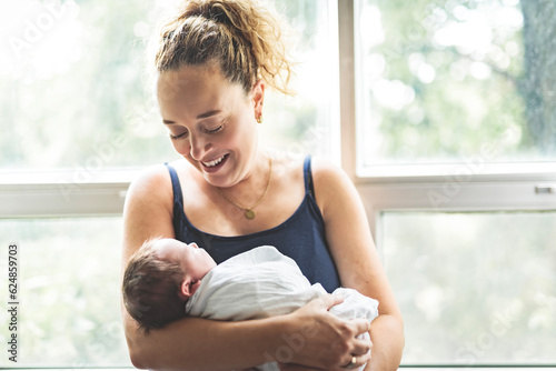 Free Download New born baby boy resting in mothers arms - GFXLoad