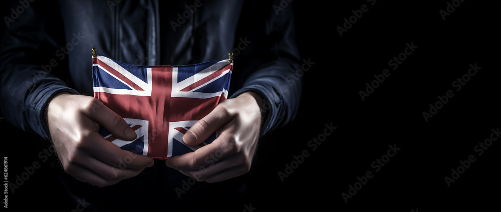Fototapeta premium A Hand Holding united kingdom Flag for uk Independence Day or National Day with A union jack Flag Background. Generative AI.