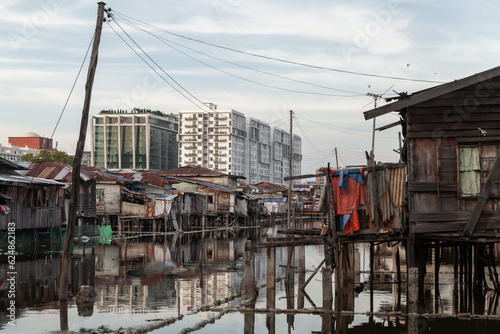 Kota Kinabalu, Malaysia. Rickety poor residential houses © evannovostro