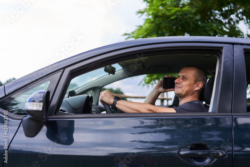 Man inside car speaking on phone