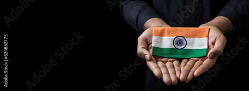 A Hand Holding India Flag for Indian Independence Day or National Day with A Indian Flag Background. Generative AI.