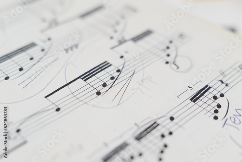 close up of musical notation and musical notes on a sheet of paper