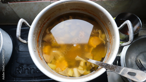 Close-up view of Sayur Asem or Sayur Asam in the saucepan. Sayur Asam is a typical Indonesian vegetable soup. A classic Indonesian vegetable dish called Sayur Asam is ready to be served. photo