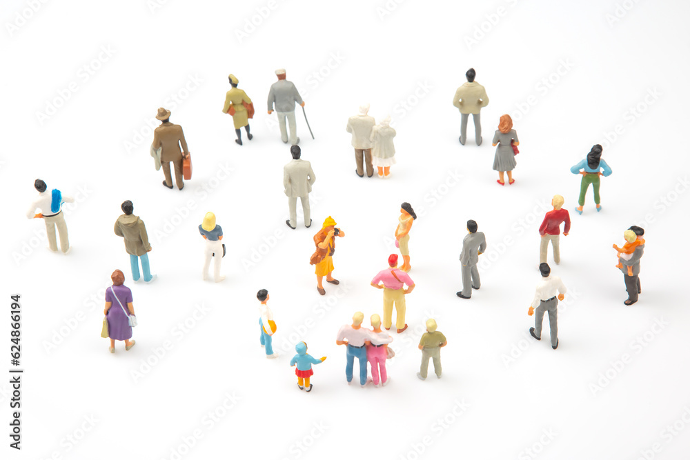 miniature people. different people stand on a white background. people communicate with each other. communication of society of different generations miniature people. different people stand on a white background. people communicate with each other. communication of society of different generations