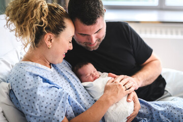 New born baby boy with the family in the hospital room