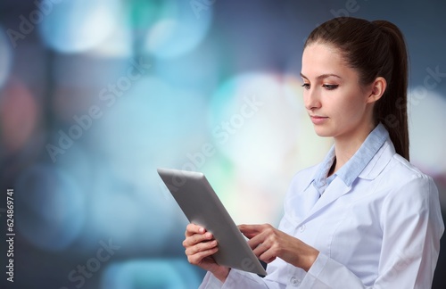 Medical, research doctor hold tablet computer for planning