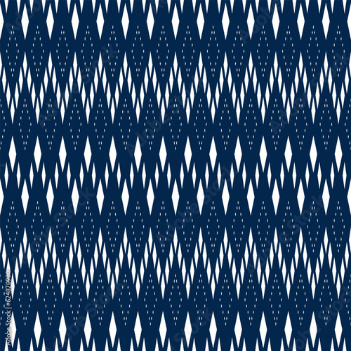 Seamless pattern with white rhombus arranged in a beautiful pattern on a blue background Used for fabric, paper or wallpaper. Vector illustration.