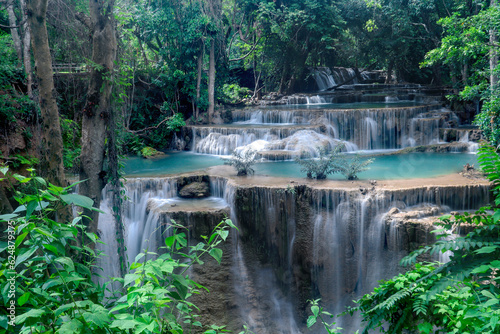 Fototapeta Naklejka Na Ścianę i Meble -  Beautiful nature Huai Mae Khamin waterfall in summer season, cataract falls in green rainforest, the large natural water resources in tropical jungle of Kanchanaburi province, Thailand.
