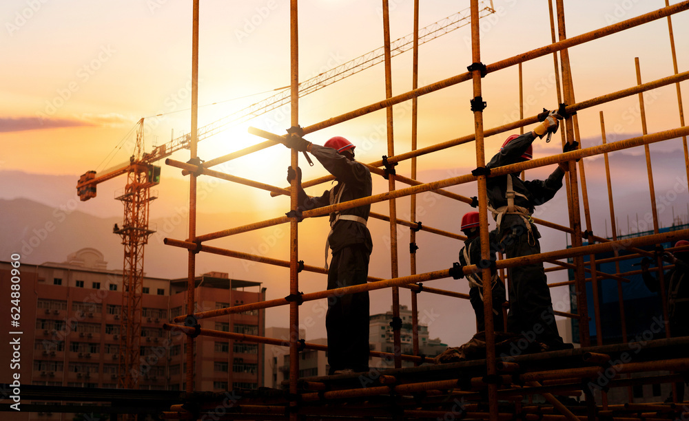 Group of construction workers working on scaffolding