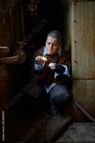 Portrait of hungry homeless castoff young woman eating canned food