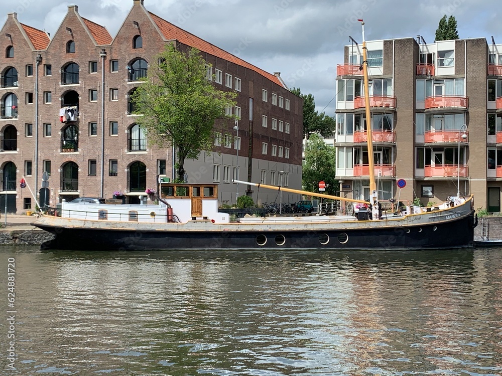 Naklejka premium Ship moving over water in Amsterdam, NL