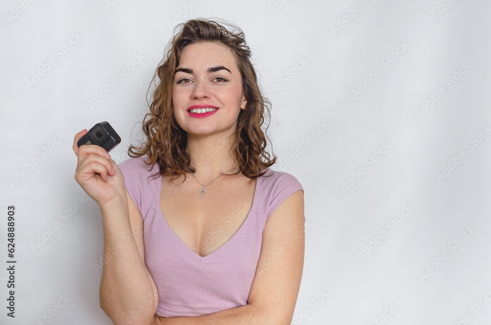 Fototapeta premium Portrait of a lovely woman. Dressed in a lilac top. Take a photo.