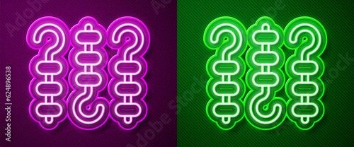 Glowing neon line Grilled shish kebab on skewer stick icon isolated on purple and green background. Meat kebab on skewer stick. Picnic with grilled meat. Vector