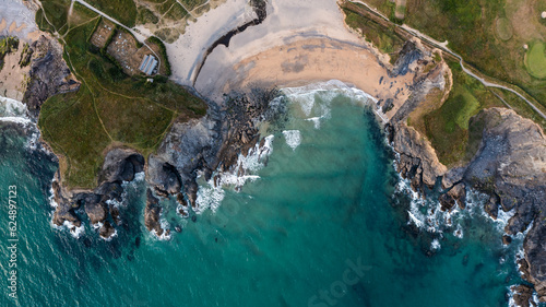 Aerial view of directly above the beach and cliffs of Church Cove Gunwalloe in Cornwall