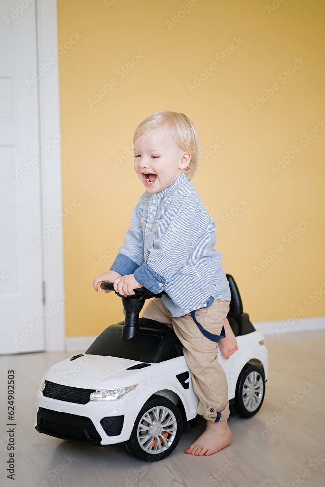 Cute little boy driving children's electric toy Cute little boy driving children's electric toy