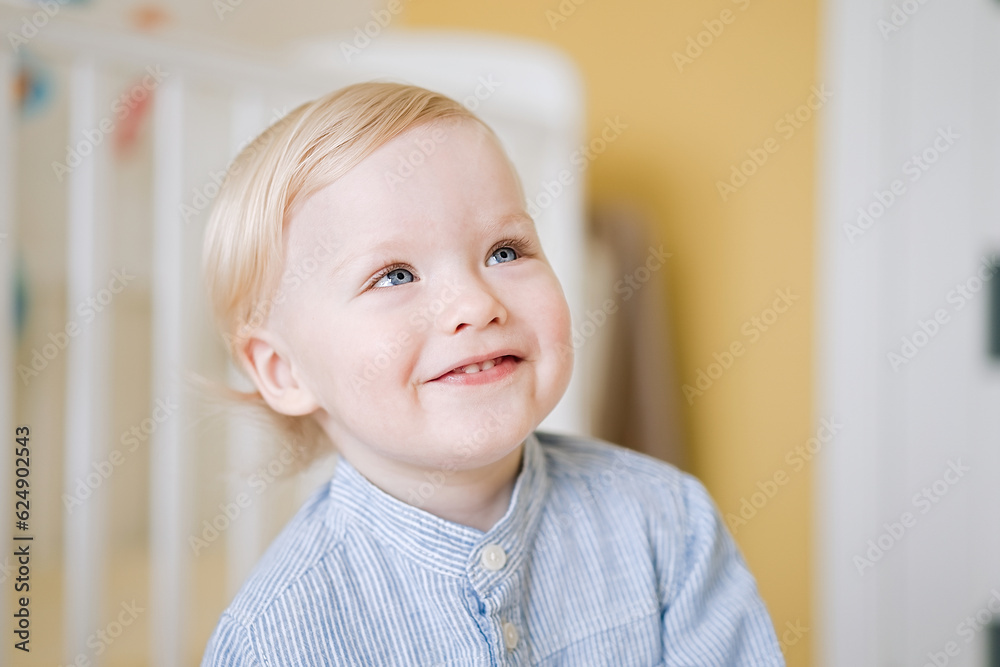 Portrait of cute happy child close-up of smiley face little kid 2 year old. Pretty little boy at home