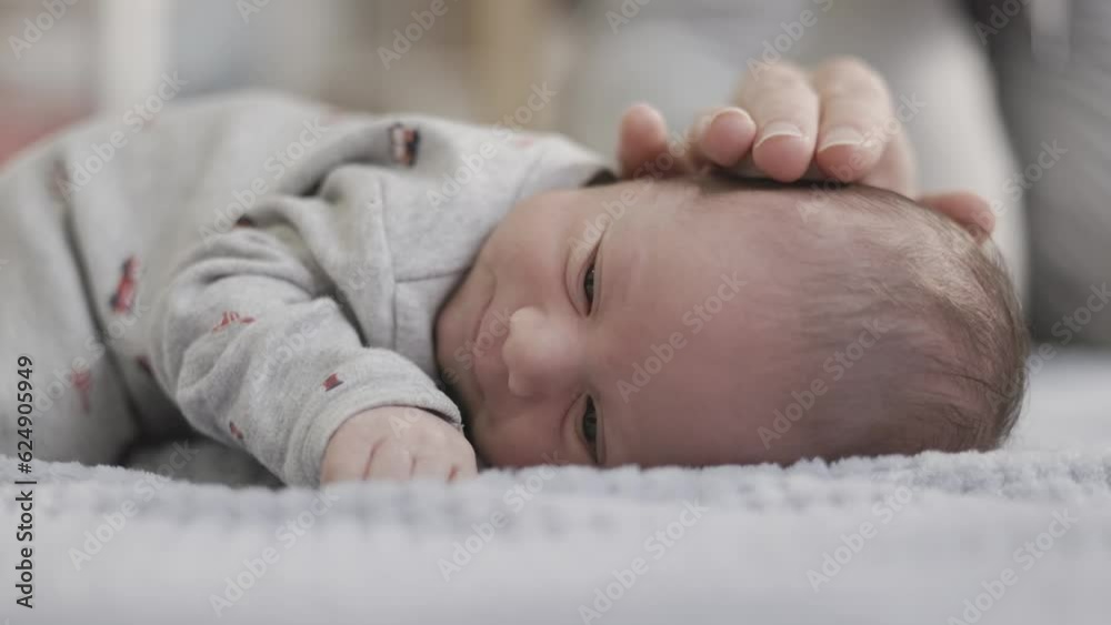 Adorable Newborn Baby Boy laying on blanket. Slow Motion Cinematic close up. Adorable Newborn Baby Boy laying on blanket. Slow Motion Cinematic close up.
