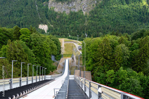 Looking down from a ski flying hill photo