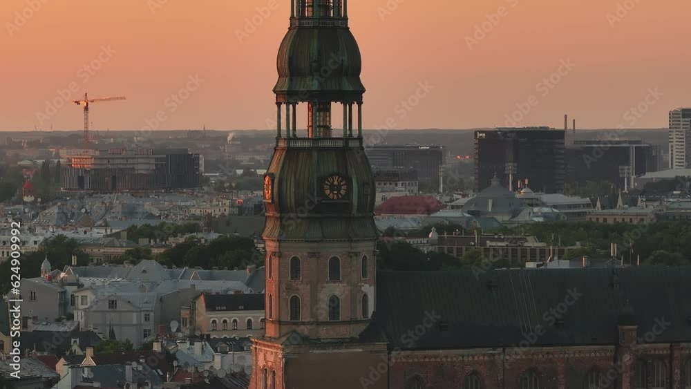 Summer sunset in Riga, Latvia. Aerial view of Riga, the capital of Latvia at sunset. Beautiful buildings, bridges and transport going through the city.