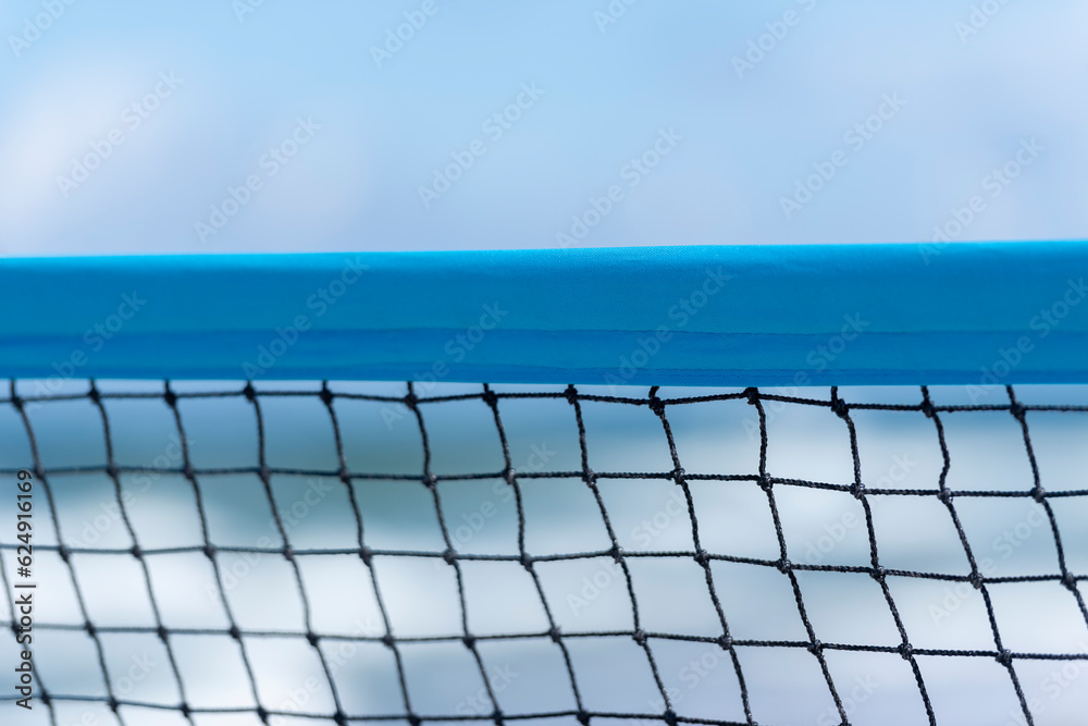 Beach volleyball and beach tennis net on the background of sand. Horizontal sport theme poster, greeting cards, headers, website and app Beach volleyball and beach tennis net on the background of sand. Horizontal sport theme poster, greeting cards, headers, website and app