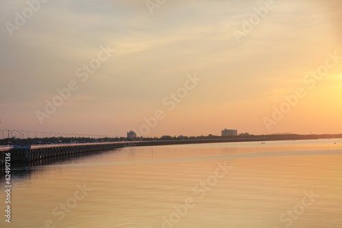 View of the bridge on the sea in the orange sky at Chonburi province Thailand