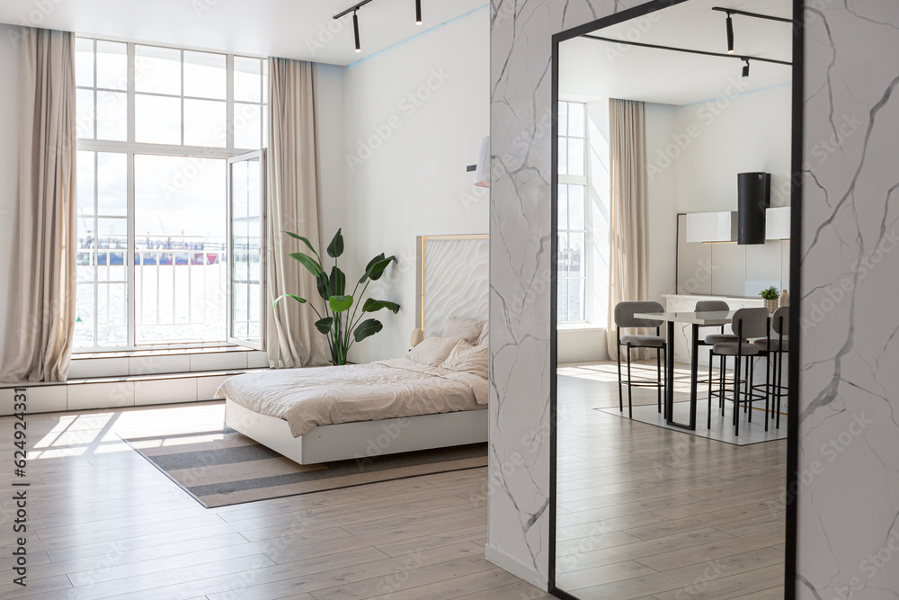 Fototapeta premium minimalistic modern luxury design of an expensive house with marble trim on a sunny day. white walls with plaster, parquet, decorative lighting and no one inside