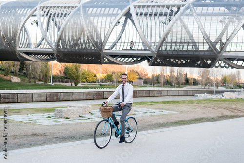 Business man riding a vintage bicycle in the city.