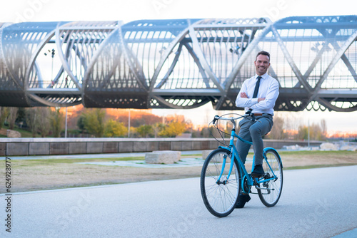 Business man riding a vintage bicycle in the city.