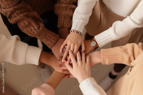 Agreement  teamwork  cooperation  solidarity community concept. Multiethnic people holding hands together yellow background  diverse multiethnic business team promising help and support. Generative AI