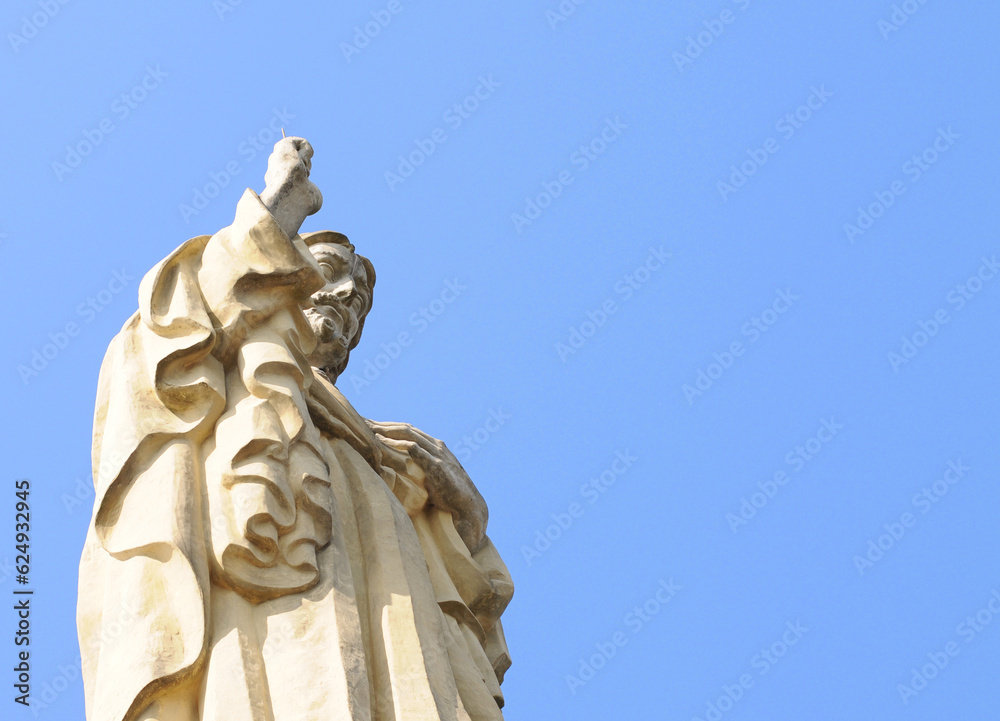 Sacred Heart Christ sandstone statue against blue sky on Mount Urgull in San Sebastian or Donostia in Spanish Basque Country, Europe