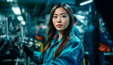 Asian Woman in the automotive industry checking equipment performance