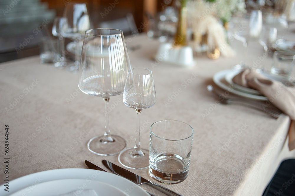 beautiful table setting with flowers and cutlery on wooden table at wedding or dinner. stylish tablewear decorations beautiful table setting with flowers and cutlery on wooden table at wedding or dinner. stylish tablewear decorations