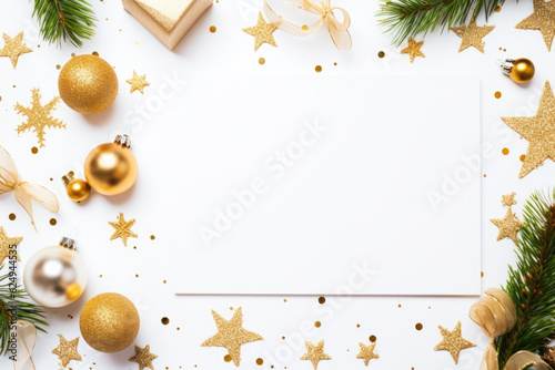 Christmas decoration with golden stars and baubles. Space for text.
