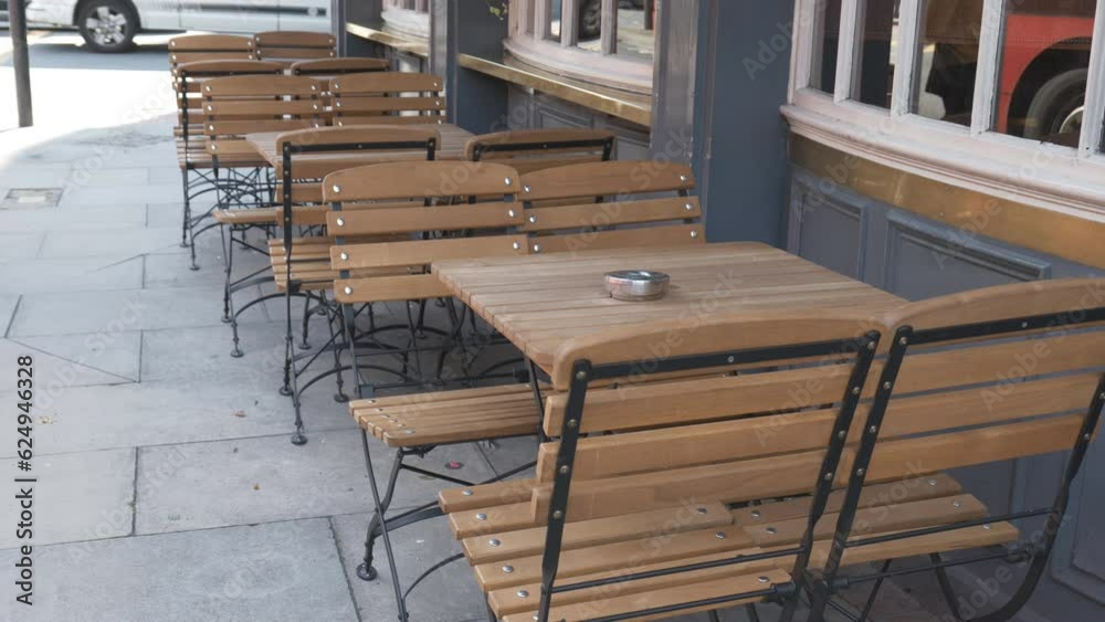 Tables and chairs outside of a street cafe. Tables and chairs outside of a street cafe.
