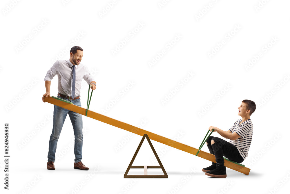 Father playing on a seesaw with a boy