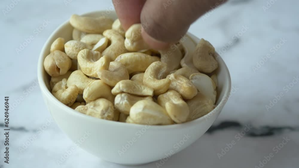 hand pick cashew nuts on table hand pick cashew nuts on table